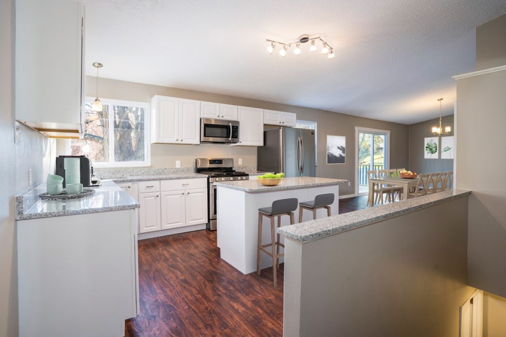 a kitchen with white cabinets