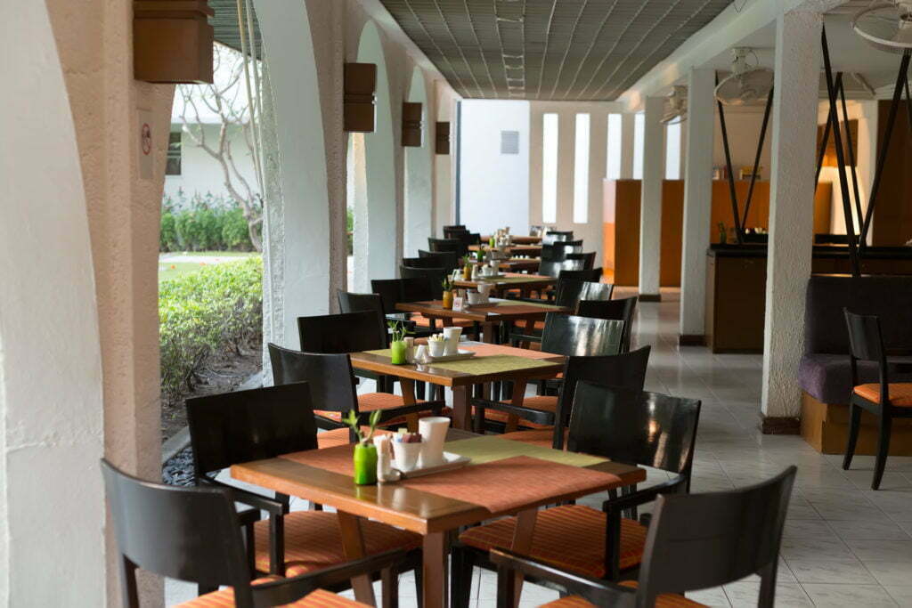 a dining room with tables and chairs