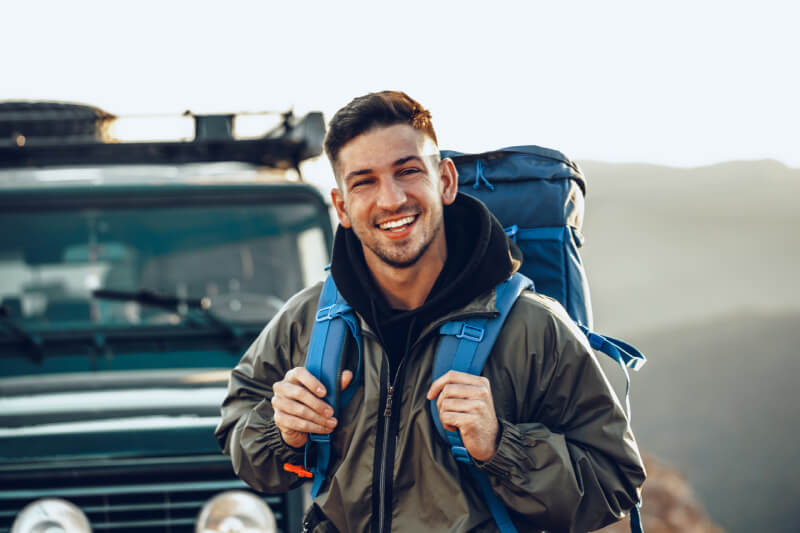 a man smiling and pointing