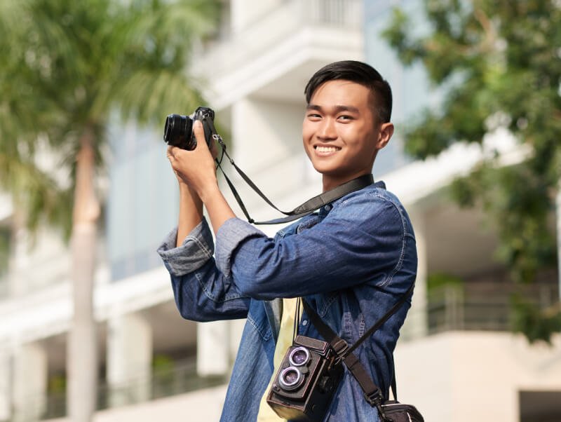 a person holding a camera