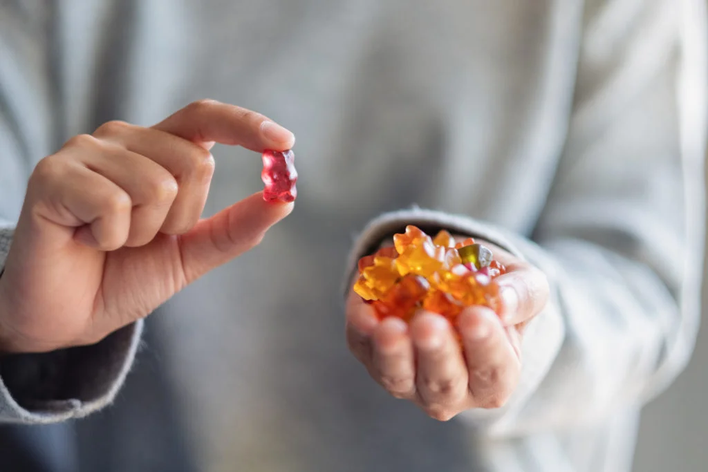 a person holding a small round object